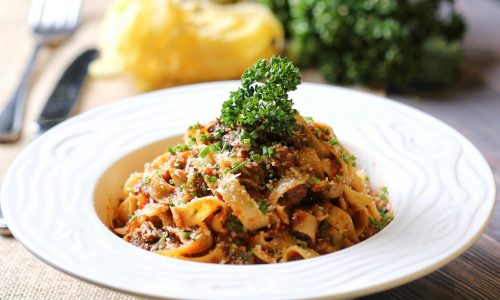 Mouth-watering pasta with rich sauce and fresh parsley garnish